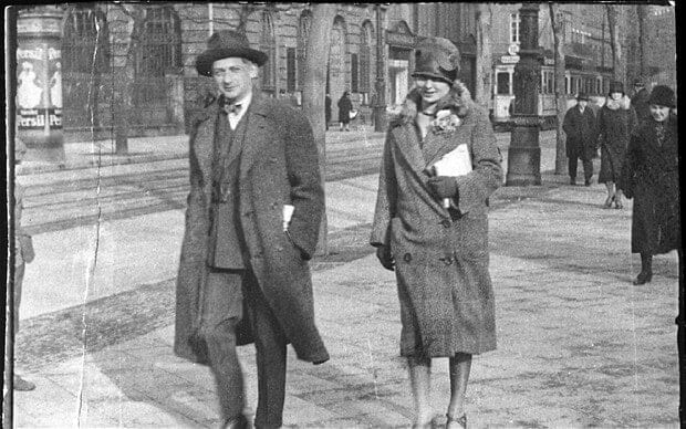 Man and woman walking down street
