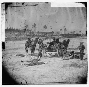 Ambulance Corps. Method of removing wounded from the field depicts the aftermath of battle in the American Civil War. 