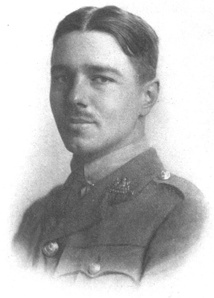Man with hair parted down middle with msutache and in British uniform