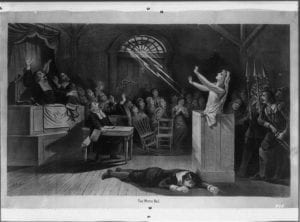 Black and white print of an illustration showing the Salem Witch Trials