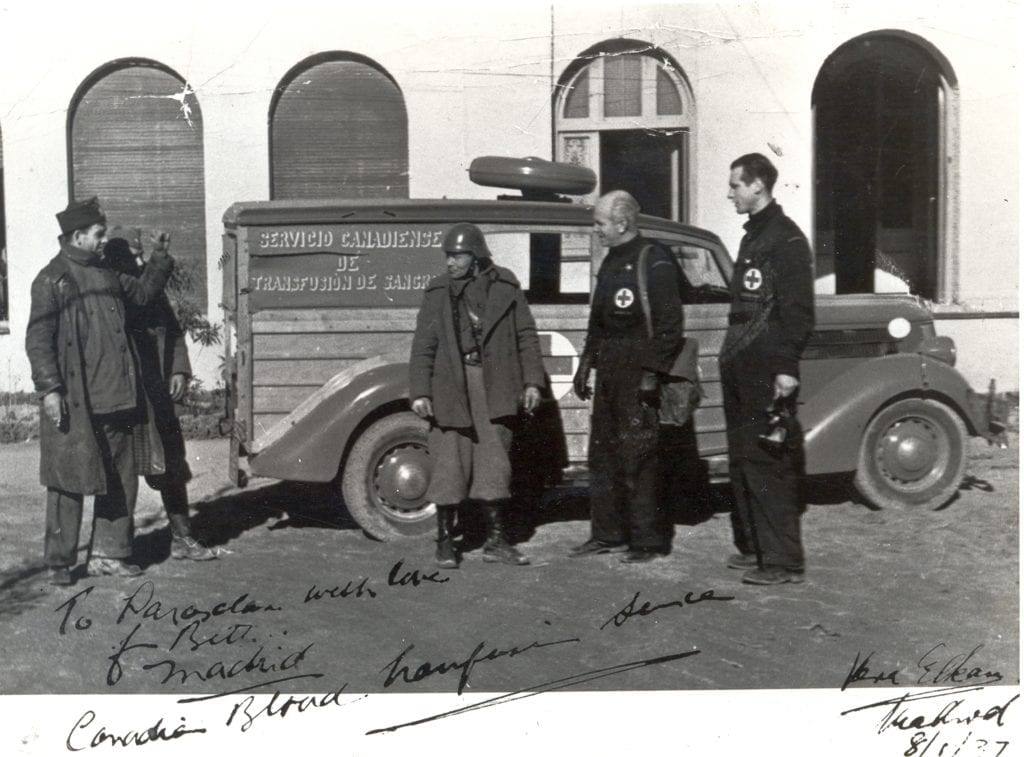 Norman Bethune and Hazen Sise in front of their mobile blood unit.