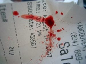 Receipt spattered with blood, perhaps from a former blood donation or sale