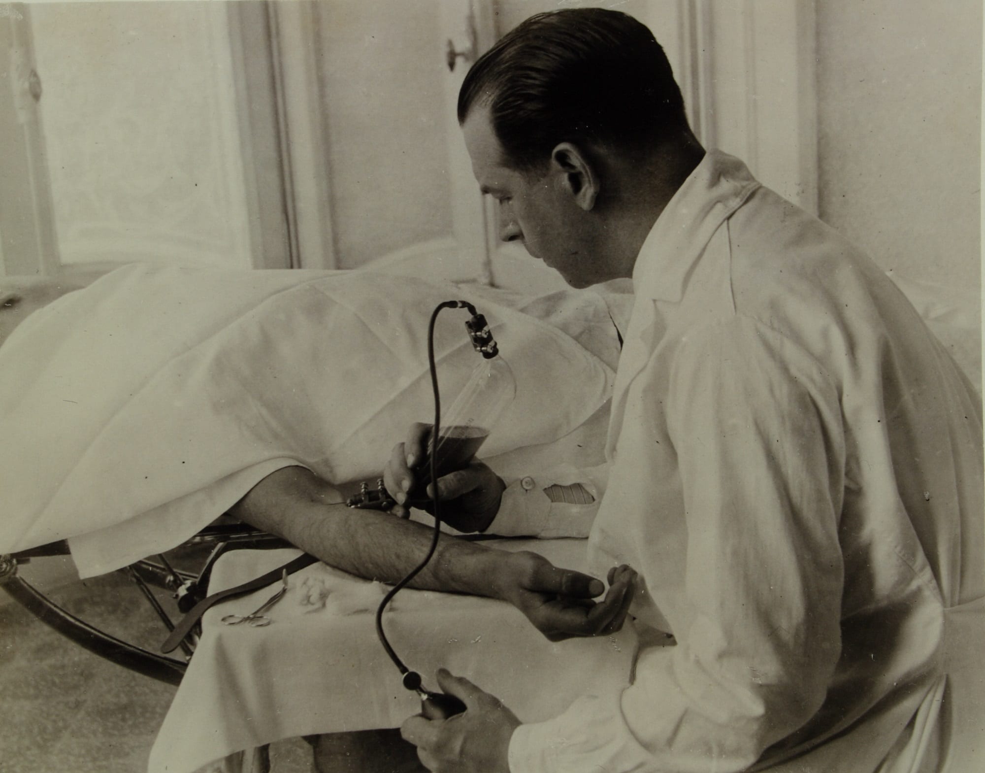 Doctor performing blood transfusion