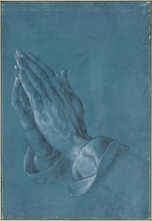 A set of hands held in the prayer position. The background is blue