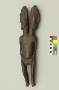 Two headed wooden figure, possibly conjoined twins