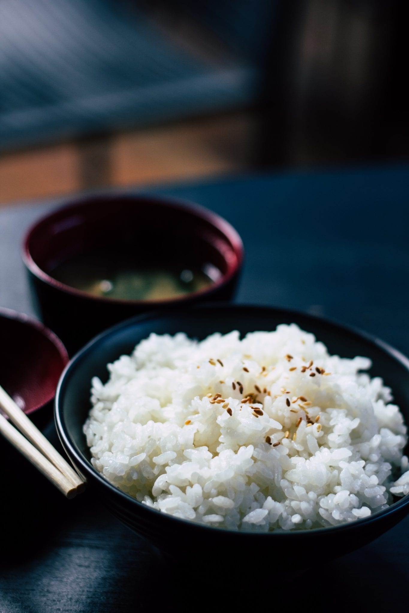 White rice in a dark colored bowl
