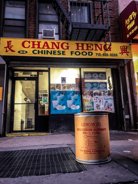 Photo of Chinese restaurant with a barrel of MSG in front of it.