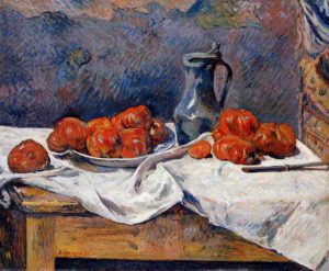 Small piles of tomatoes on a table with a jug on a white tablecloth on a wooden table and a blue background