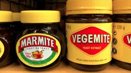 Jars of Marmite next to jars of Vegemite