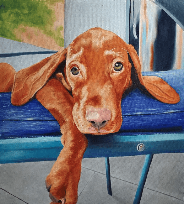 Painting of brown dog with floppy ears lounging and looking up at viewer